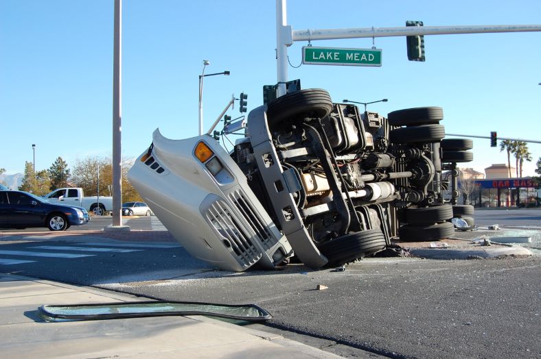 overturned semi-truck after getting into an accident