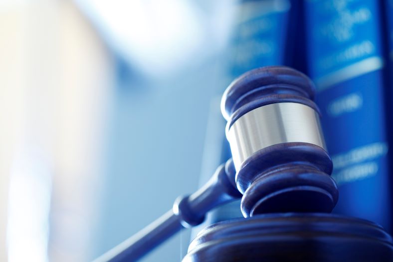 court gavel in a blue blur background