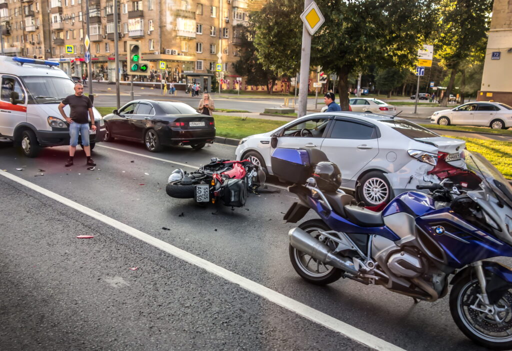 motorcycle and car accident scene