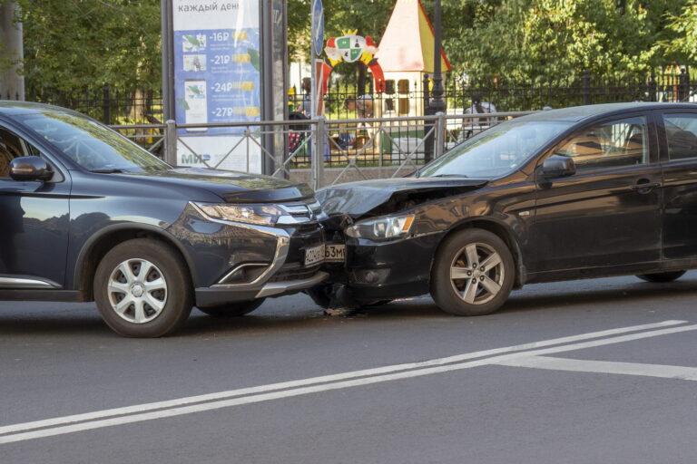 two cars with body damage after a car accident collision in Colorado Springs, Colorado