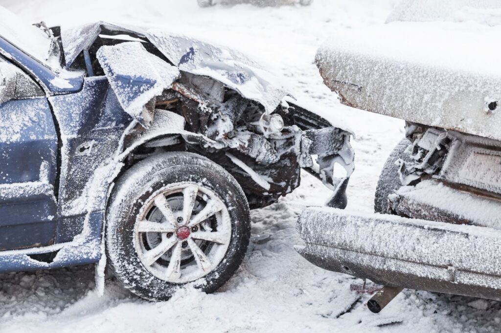 A severely damaged vehicle after a car accident due to the snow.