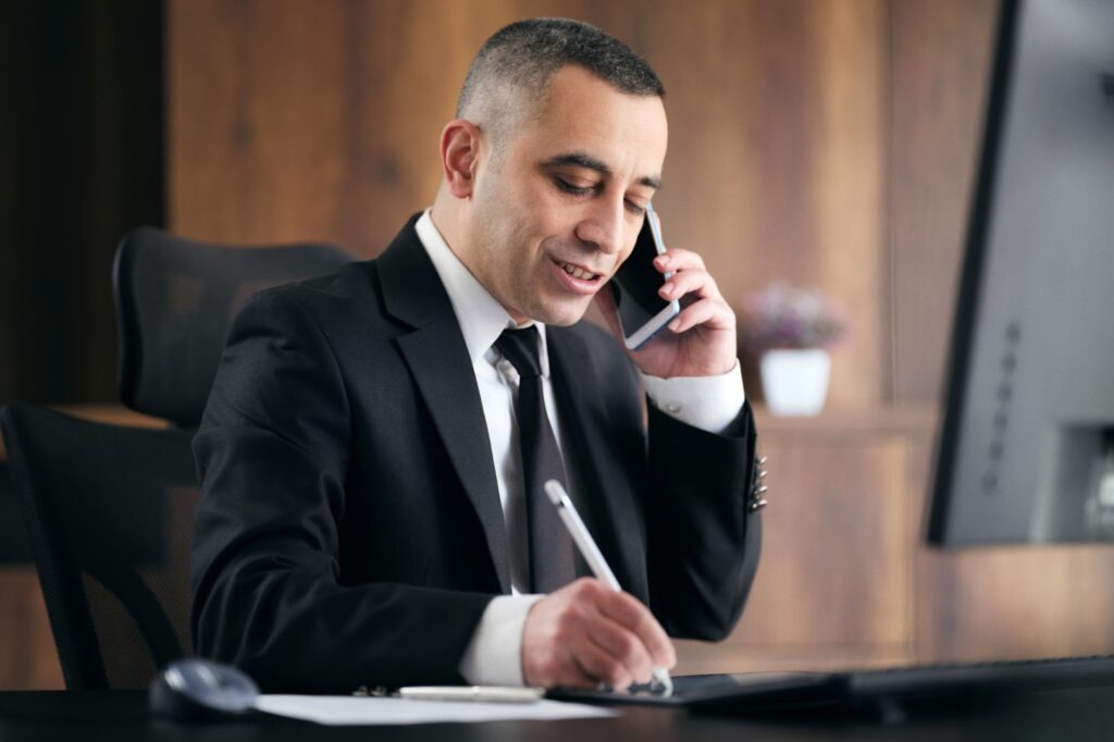 catastrophic injury lawyer on the phone with a burn injury victim