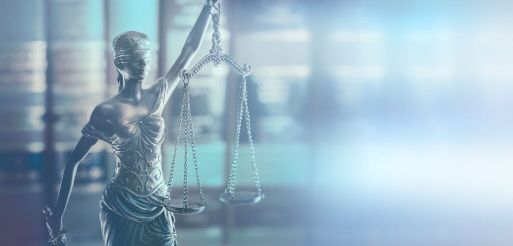 scales of justice with blurry background
