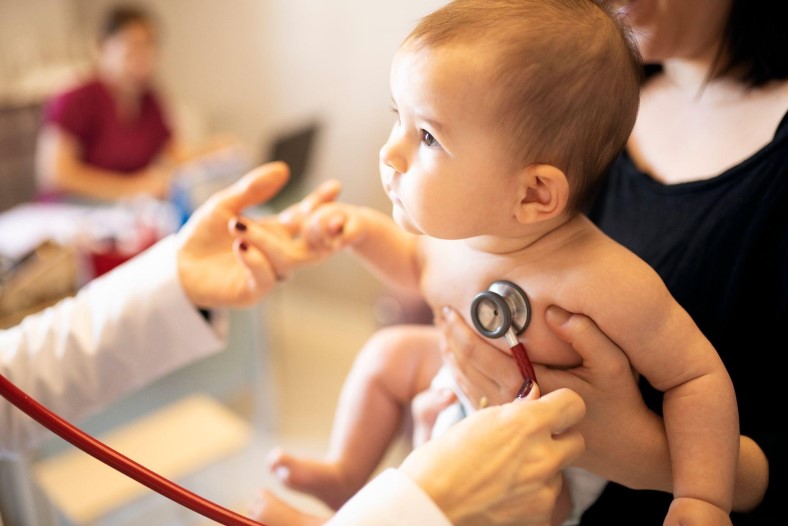 baby getting heart rate checked by doctor