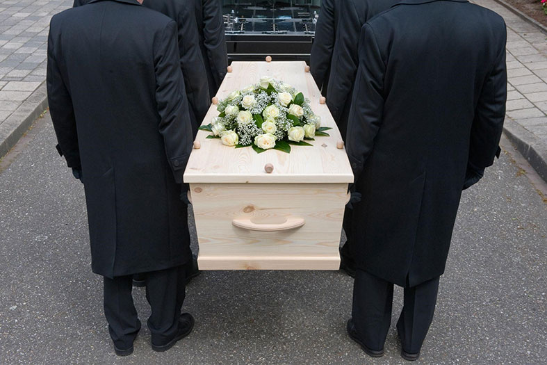 paulbearers walking with a casket