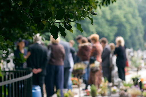 family mourning loved one at funeral