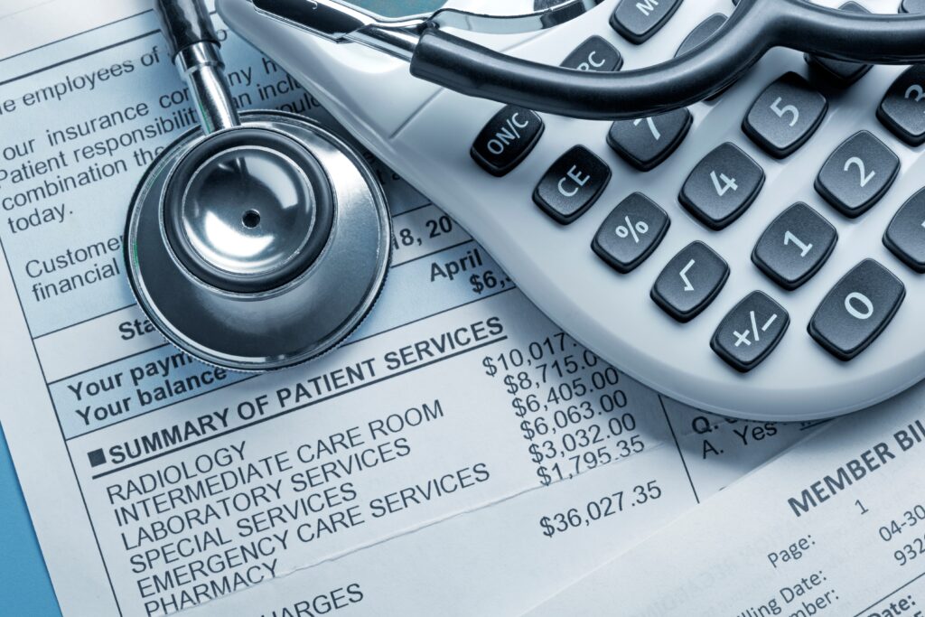 stethoscope and medical bills