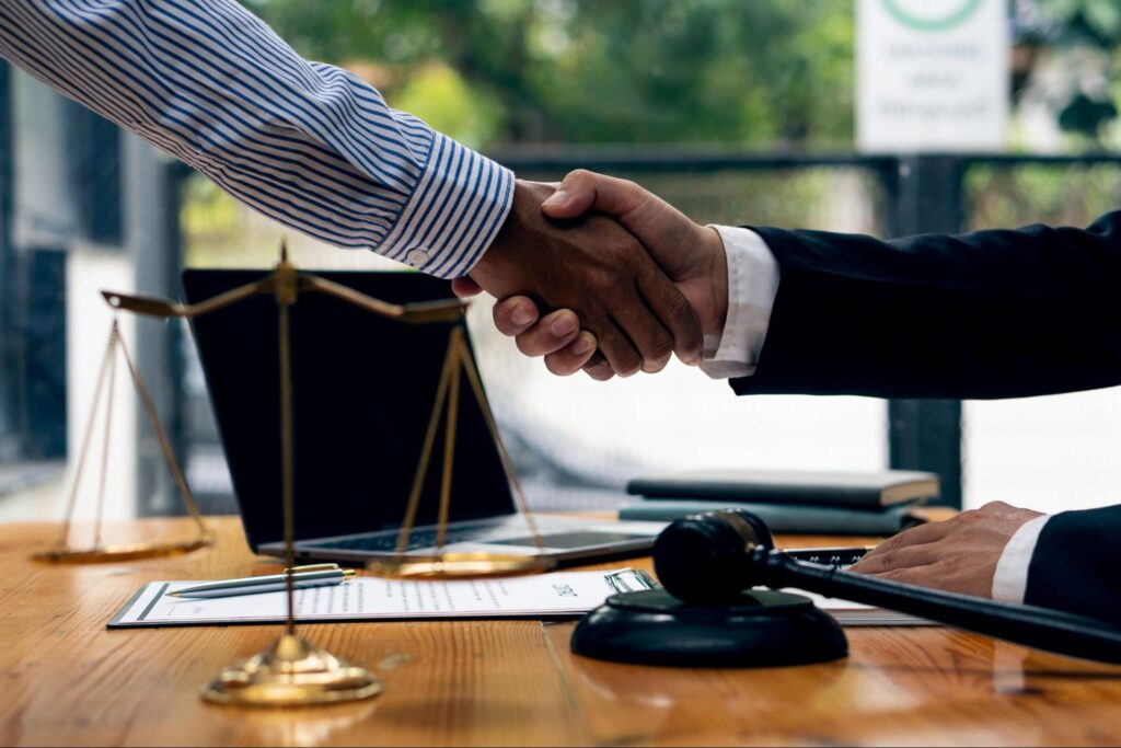 wrongful death lawyer shaking hands with client