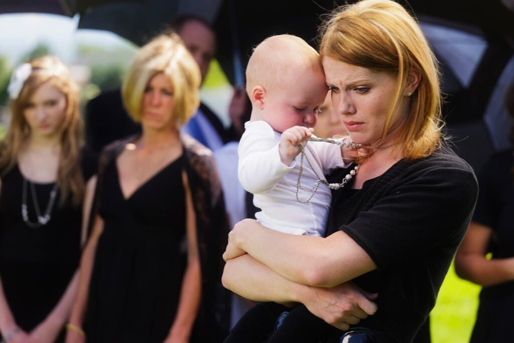 mother and baby at a funeral