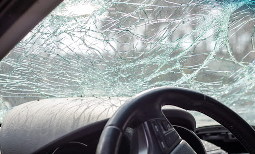 A cracked windshield after a car accident in Denver, Colorado