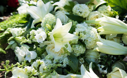 green memorial flowers at a wrongful death ceremony