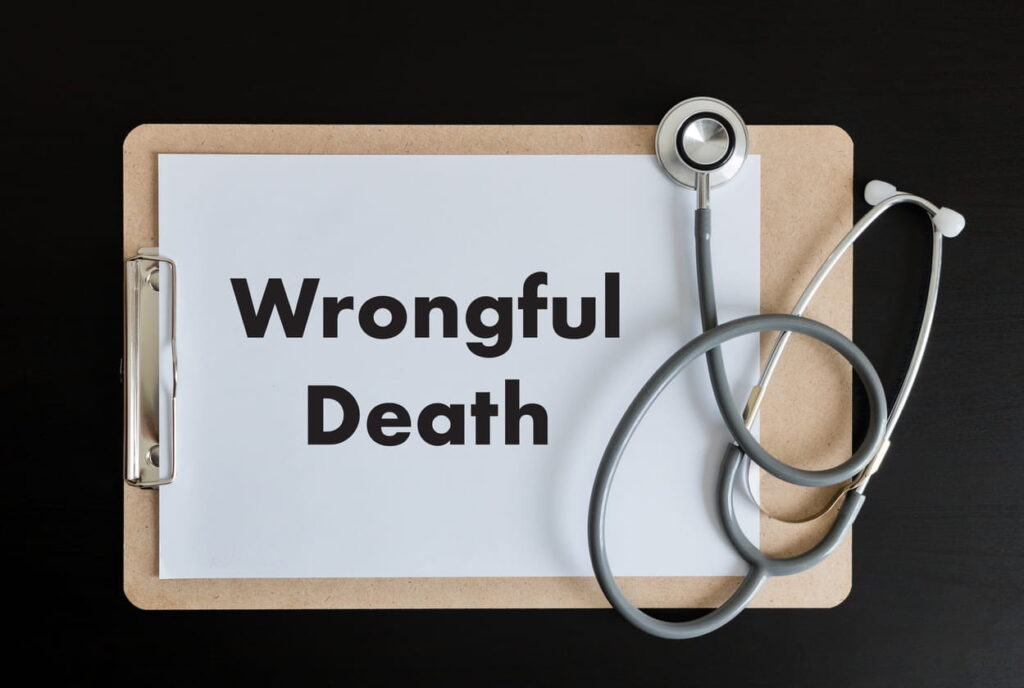 A clipboard that reads "wrongful death" with a stethoscope over it.
