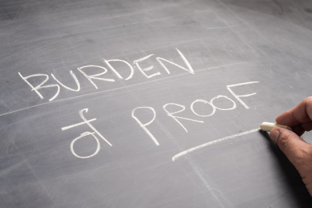 "Burden of Proof" written on a chalkboard.