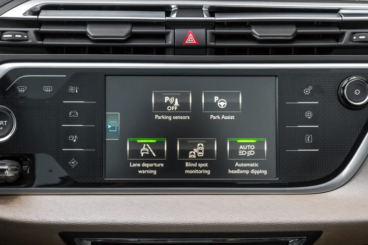 Car safety features on a vehicle's touch screen. 