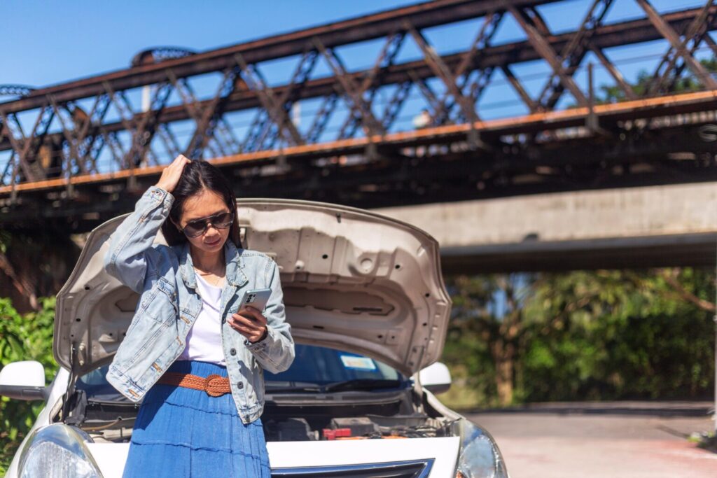 lady calling emergency help after car accident