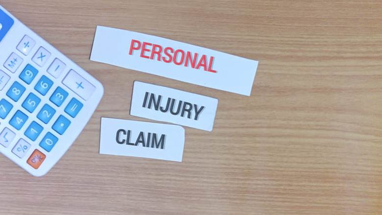 Text that reads "Personal Injury Claim" next to a calculator.