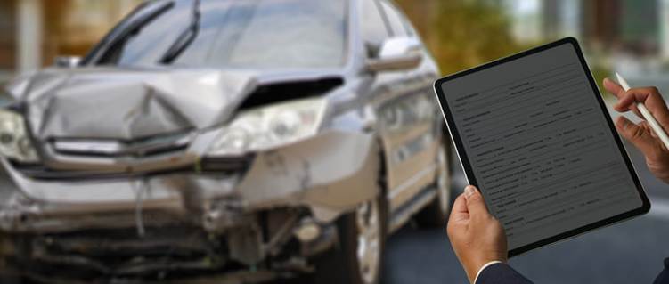 A personal injury lawyer fills out a form regarding a rideshare accident claim.