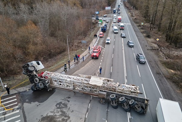 A semi-truck on its side after an accident.