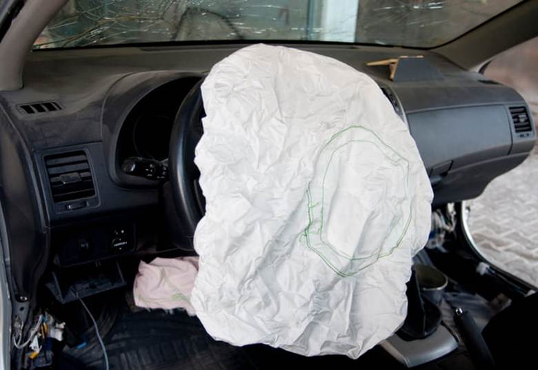 A deployed airbag after a car accident.